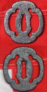 An Edo Period Iron Mokko Form Tsuba Engraved with Geometric Manji Design