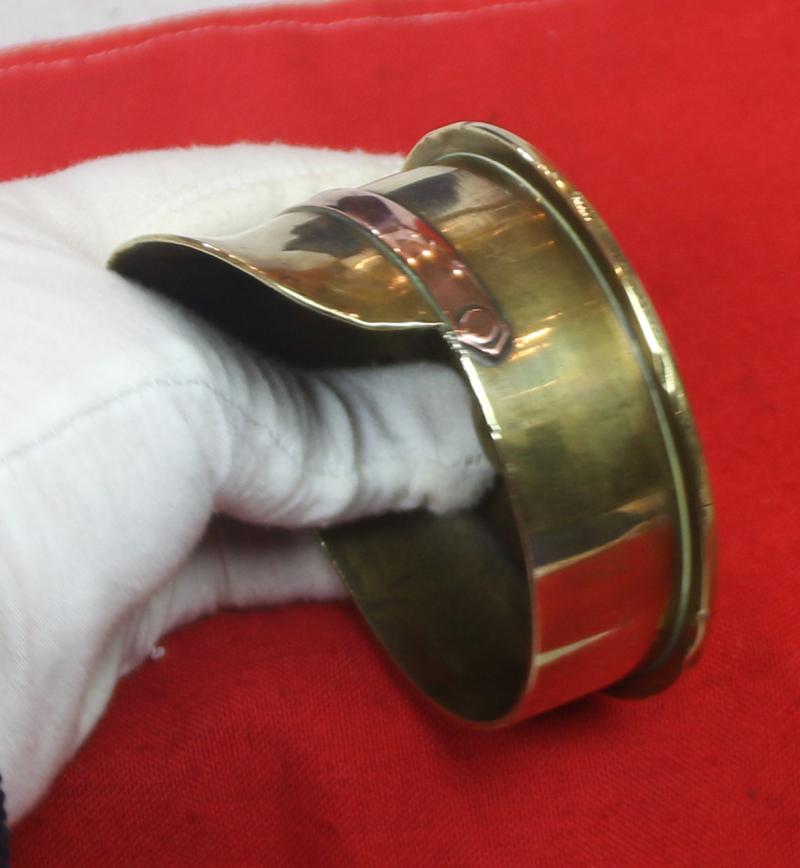 A Delightful Piece of Large Quality 'Trench Art'. A German Shell Trench Engineered Into The Form Of A British 1905 Pattern Trench Service Cap. Wonderful Quality