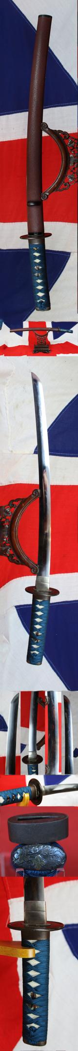 A Good Yoshii School Wakazashi, Likely Muromachi, Signed Yoshii Mitsunori Dressed With A Stunning Livery of Brown Ishime Lacquer Complimented With a Finest Blue Silk Tsukaito Hilt Wrap