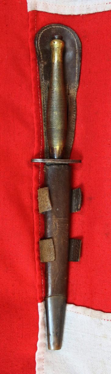 A Fabulous, WW2 Special Forces, 1942 Issue, 'B2' Broad Arrow Marked Early Second Pattern FS Commando Knife. With 'Hand Ground' Blued Finish Blade & Original Leather Scabbard In Great Service-Used Condition