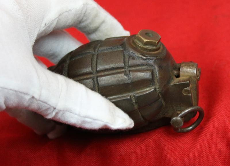 An Original, Inert, WW2 Service Issue British 'Mills Bomb' Grenade. Maker Stamped, I.B.R. by The Maker IBR {Ideal Boilers and Radiators} Ltd. Fitted With Automata Action