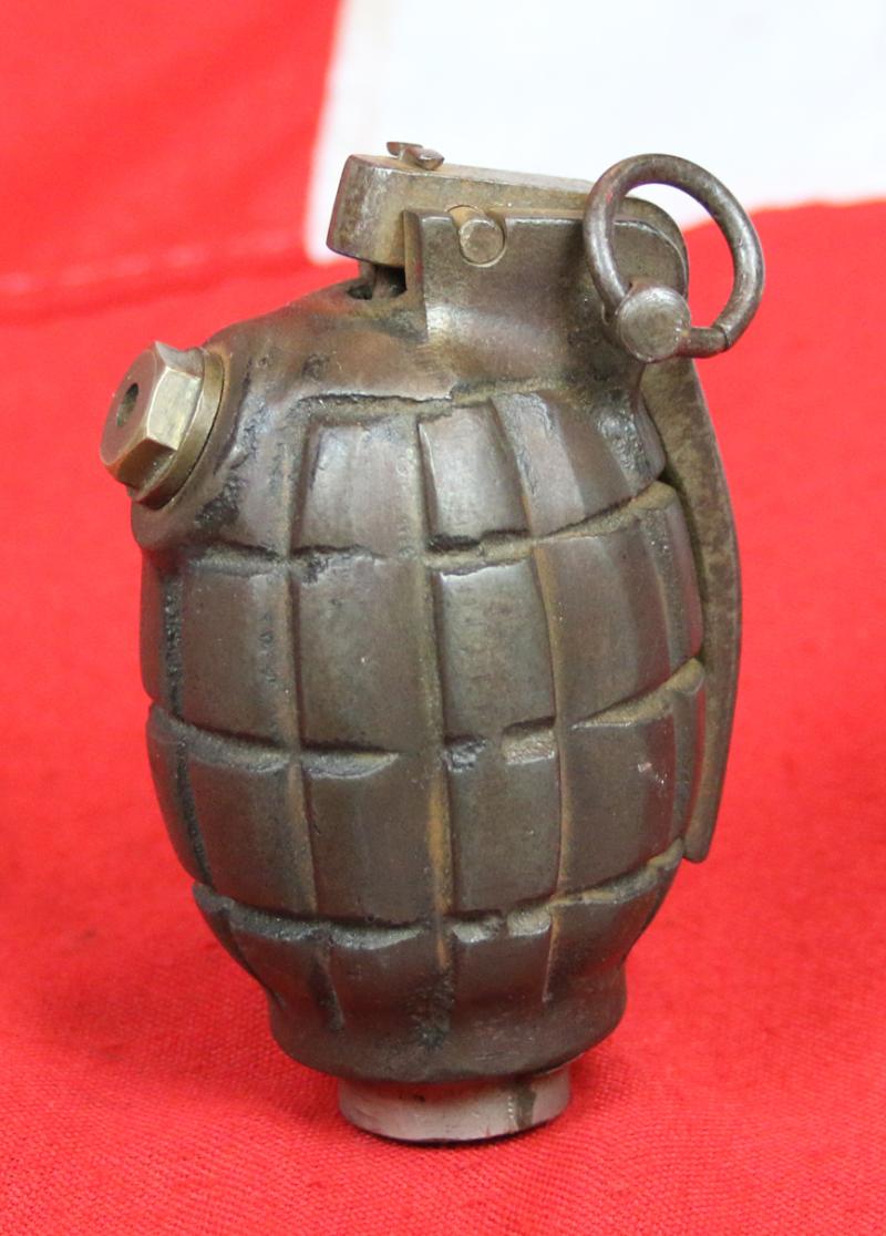 An Original, Inert, WW2 Service Issue British 'Mills Bomb' Grenade. Maker Stamped, I.B.R. by The Maker IBR {Ideal Boilers and Radiators} Ltd. Fitted With Automata Action