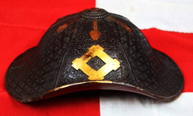 A Beautiful Edo Period Bato Jingasa Samurai Horserider's War Hat With Beautiful Four Flower Panels and Two Geometric Takebori Relief Decor In Six Distinct Panels Within the Urushi Lacquer With Clan Mon