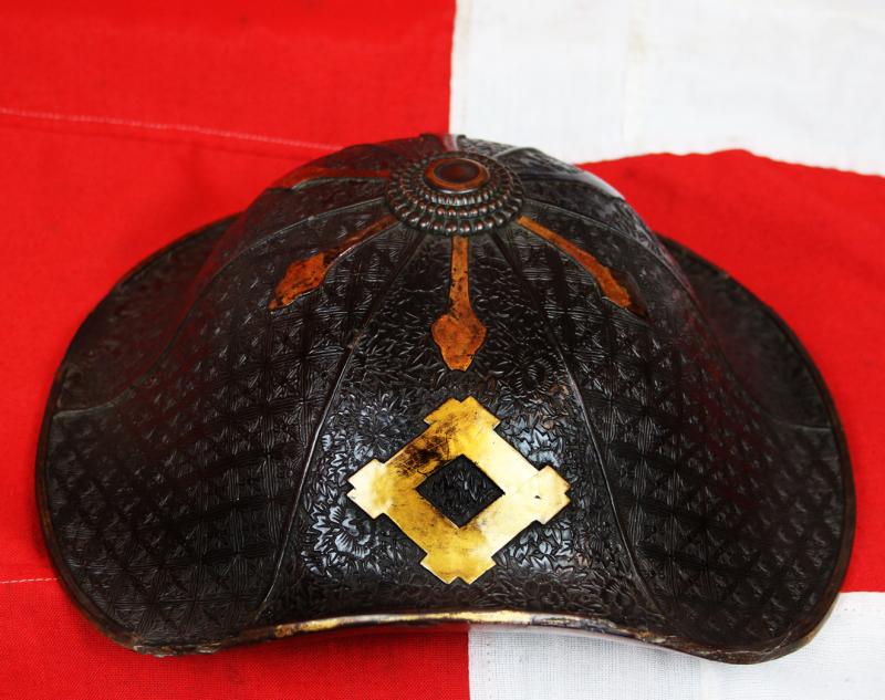 A Beautiful Edo Period Bato Jingasa Samurai Horserider's War Hat With Beautiful Four Flower Panels and Two Geometric Takebori Relief Decor In Six Distinct Panels Within the Urushi Lacquer With Clan Mon