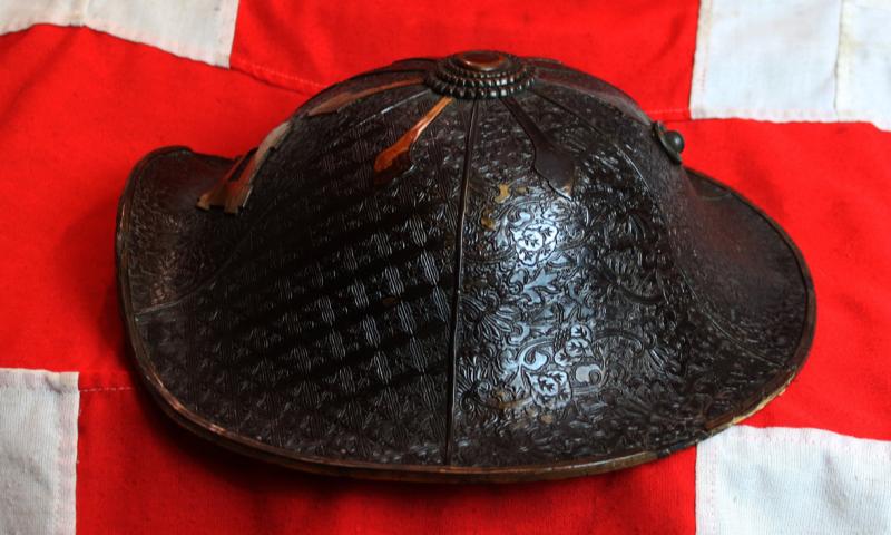 A Beautiful Edo Period Bato Jingasa Samurai Horserider's War Hat With Beautiful Four Flower Panels and Two Geometric Takebori Relief Decor In Six Distinct Panels Within the Urushi Lacquer With Clan Mon