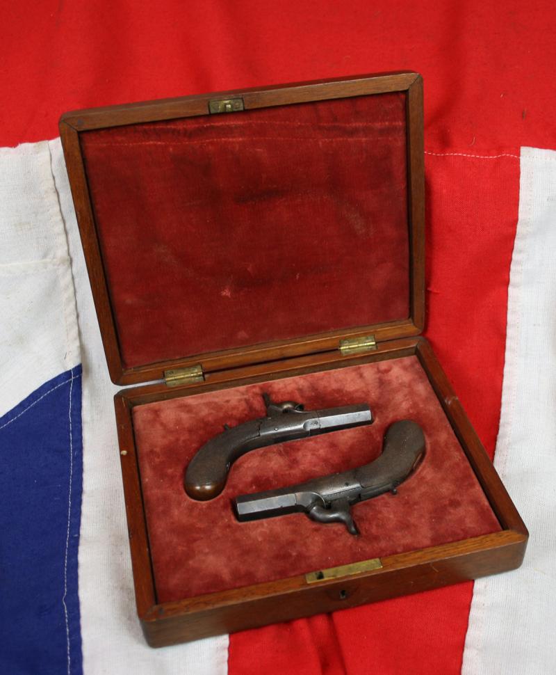 A Superb “American” Cased Pair of 1850 Derringers, Gambler’s Waistcoat or Boot Pistols By Wilson, of Superb Quality. A Very Neat Little Pair Of Large Calibre Small Pistols The Type of Earliest ‘Derringer’ Pistols Ideal For Concealment. Damascus Barrels.