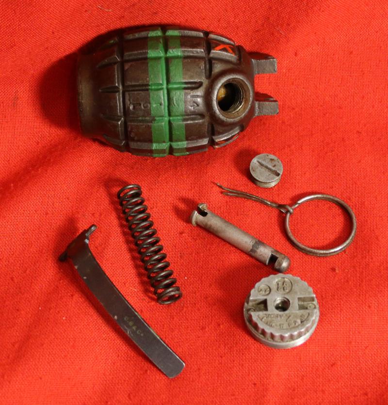 An Excellent British Army WW2 Mills Bomb Grenade In Superb Condition With Fine Paint Green Stripe For Baratol or TNT and XXX Originally Meaning Primed and Ready. Made by ICI, Siebe Gorman & Thomas Adshead & Sons. Naturally it Is Empty and Safe now.